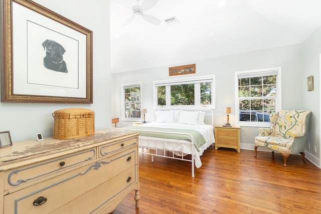 bedroom with ceiling fan and dark wood-type flooring