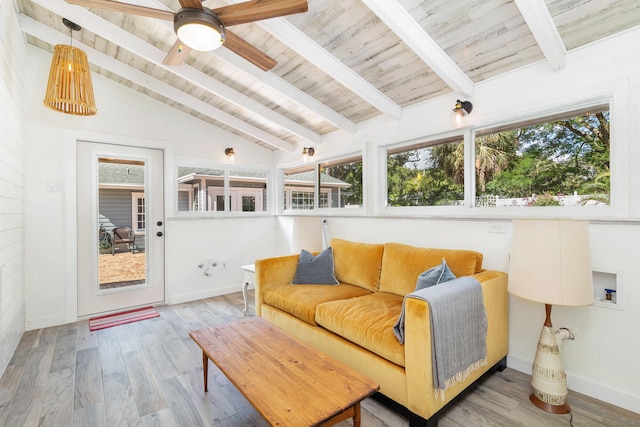 sunroom featuring lofted ceiling with beams, ceiling fan, and wooden ceiling