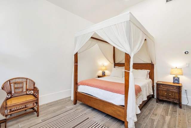 bedroom featuring hardwood / wood-style floors