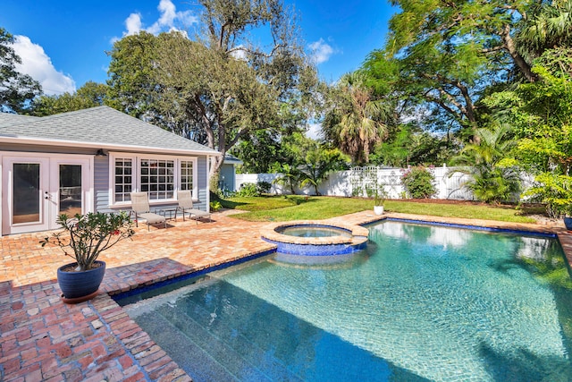 view of pool featuring an in ground hot tub, french doors, and a patio area