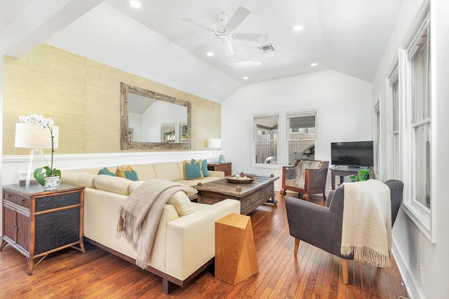 living room with dark hardwood / wood-style flooring, vaulted ceiling, and ceiling fan