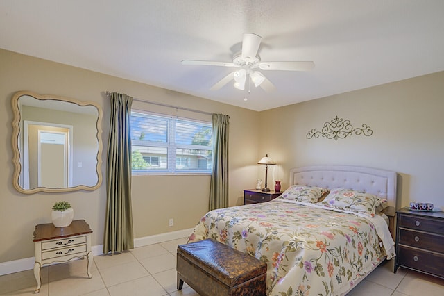 tiled bedroom with ceiling fan