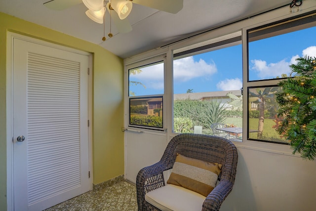 living area featuring ceiling fan