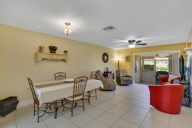 dining space featuring ceiling fan and light tile patterned flooring