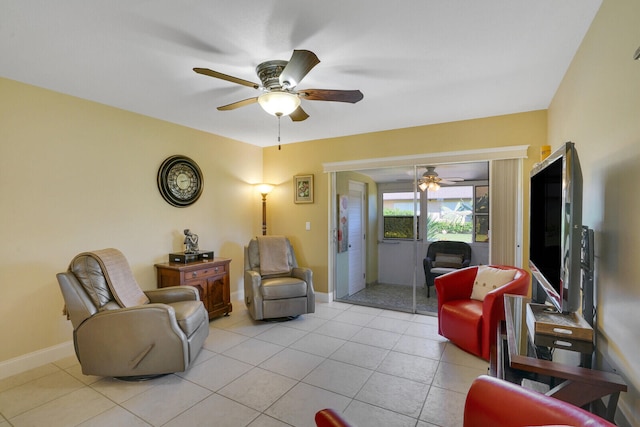 tiled living room with ceiling fan