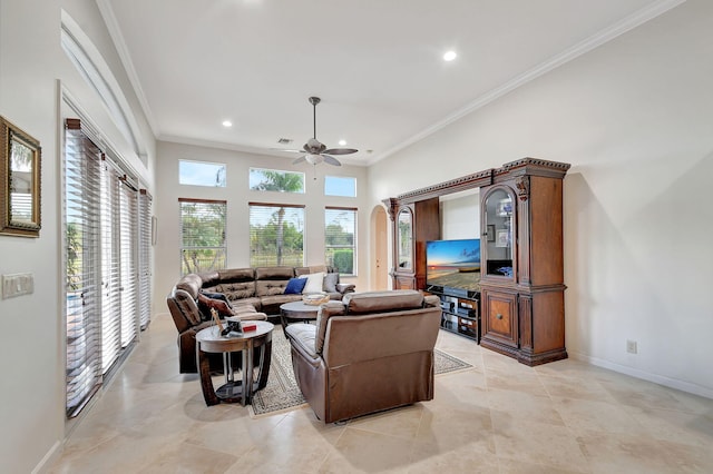 living room featuring ceiling fan, ornamental molding, and light tile patterned floors