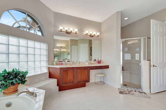 bathroom with tile patterned floors, plenty of natural light, and plus walk in shower