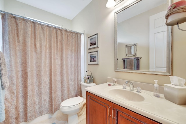 bathroom with tile patterned floors, vanity, and toilet