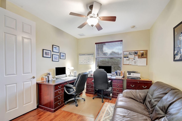 home office featuring ceiling fan and light hardwood / wood-style floors