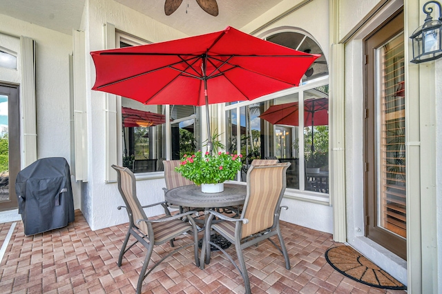 view of patio with grilling area and ceiling fan