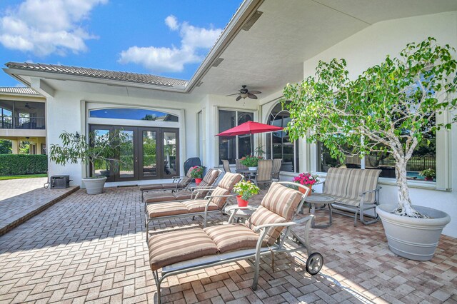 view of patio / terrace featuring french doors and ceiling fan