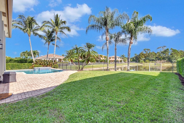 view of yard featuring a fenced in pool and a patio