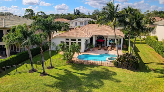 view of pool featuring a lawn and a patio