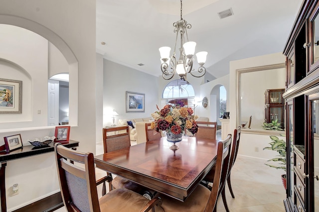 tiled dining area with a notable chandelier