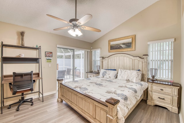 bedroom with access to exterior, ceiling fan, a textured ceiling, lofted ceiling, and light wood-type flooring