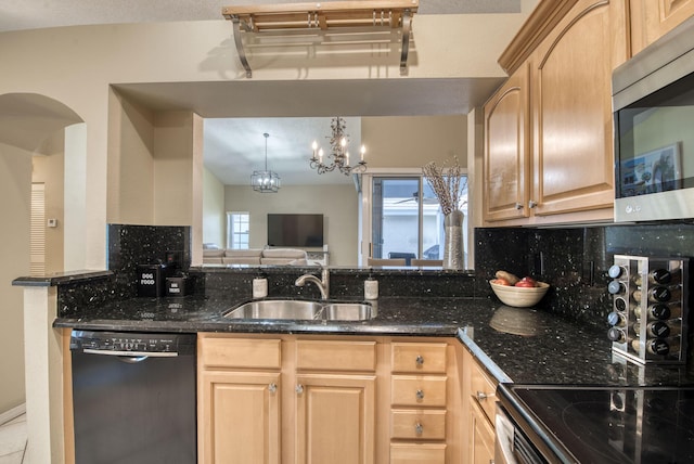 kitchen featuring dishwasher, stainless steel microwave, a sink, light brown cabinets, and decorative backsplash