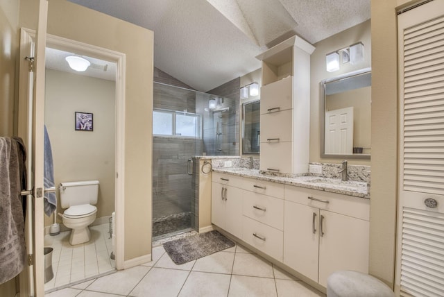 full bathroom with a shower stall, tile patterned flooring, toilet, a textured ceiling, and double vanity