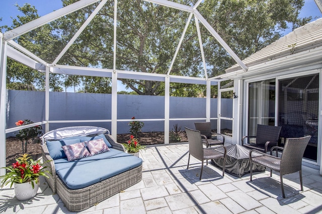 view of patio / terrace with fence and a lanai