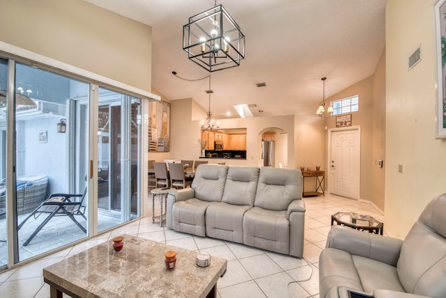 tiled living room featuring high vaulted ceiling