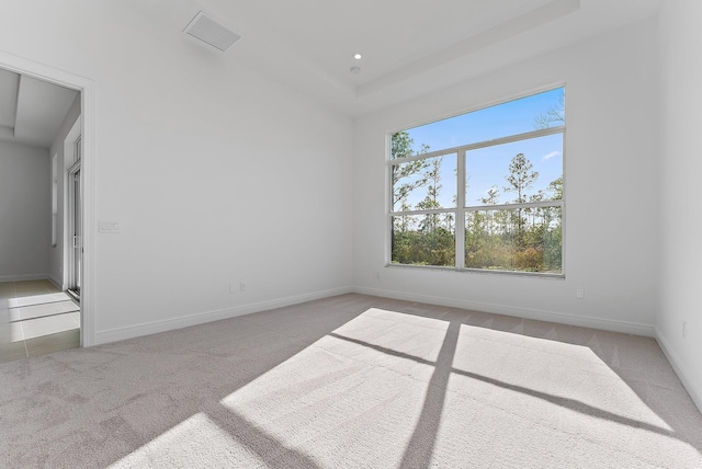 empty room featuring light carpet