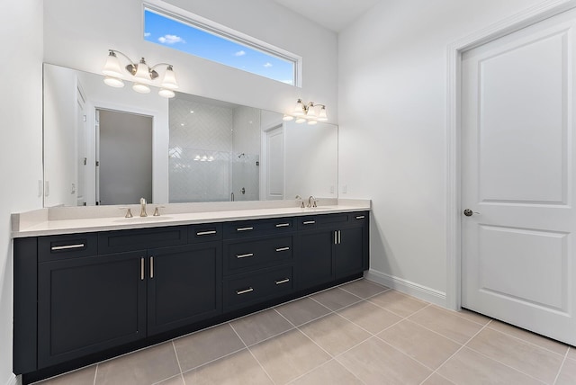 bathroom featuring tile patterned floors, vanity, and tiled shower