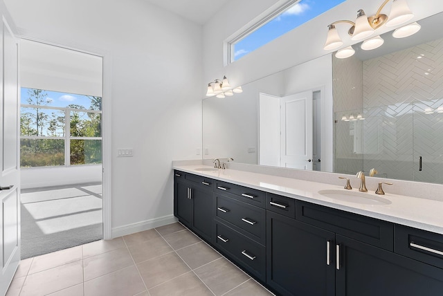 bathroom featuring tile patterned floors, vanity, and walk in shower