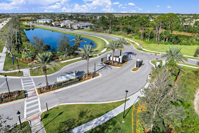 birds eye view of property with a water view