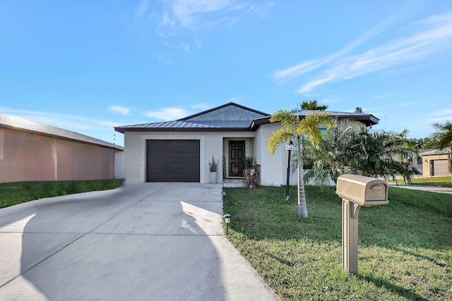 view of front facade with a garage and a front yard