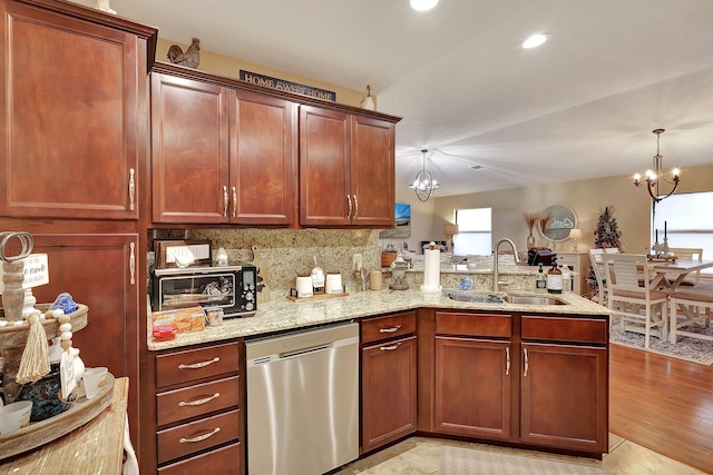 kitchen featuring pendant lighting, dishwasher, sink, a notable chandelier, and light hardwood / wood-style floors