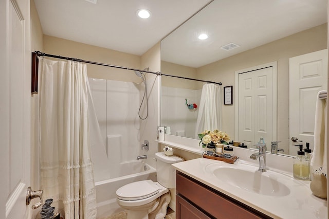 full bathroom featuring toilet, vanity, and shower / tub combo with curtain