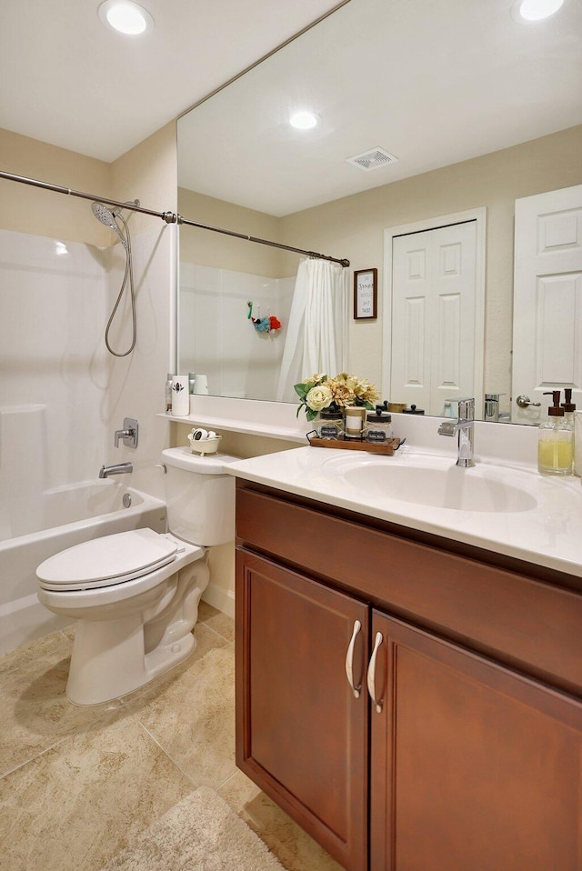 full bathroom featuring tile patterned flooring, vanity, toilet, and shower / bath combo with shower curtain