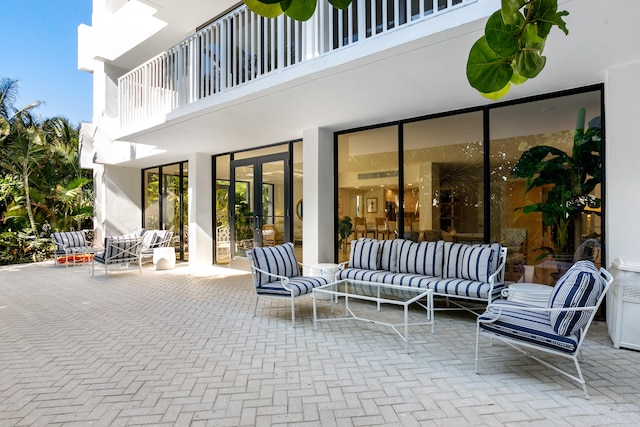 view of patio / terrace featuring an outdoor living space and a balcony