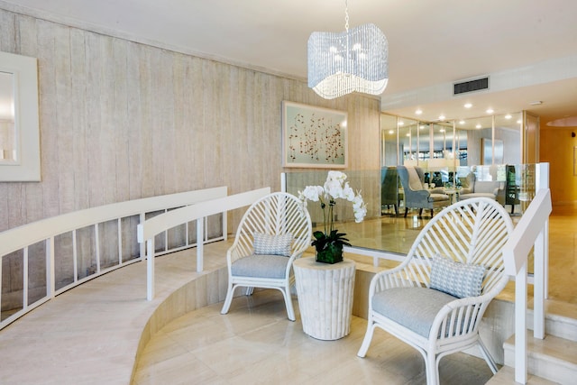 sitting room featuring a chandelier