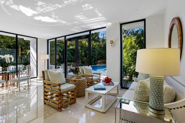 330 S Ocean Blvd Unit E1, Palm Beach, FL 33480 - living area featuring a wall of windows and plenty of natural light
