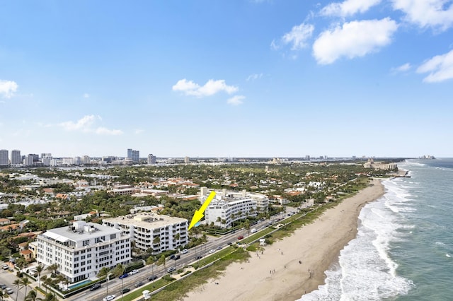 bird's eye view with a water view and a view of the beach