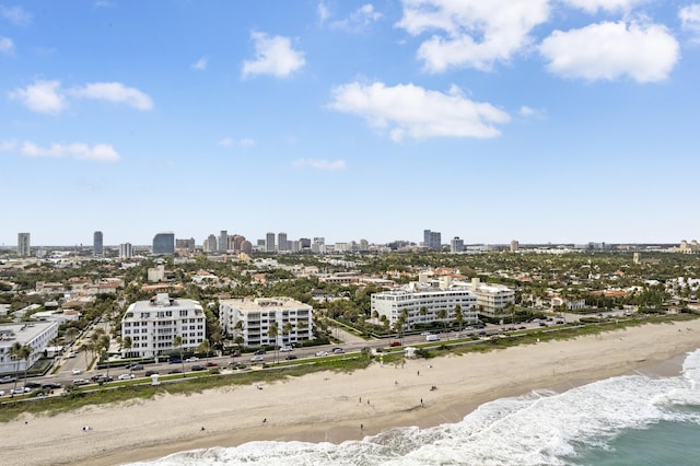 birds eye view of property featuring a view of the beach and a water view