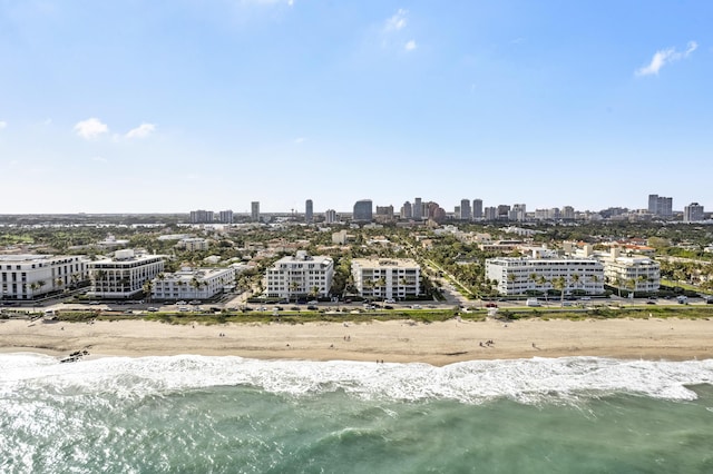 aerial view featuring a water view and a beach view