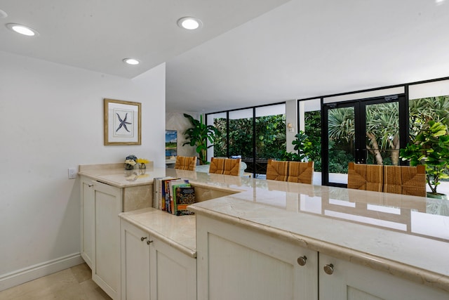 kitchen with french doors and light tile patterned flooring