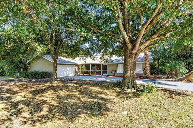 ranch-style home featuring a garage