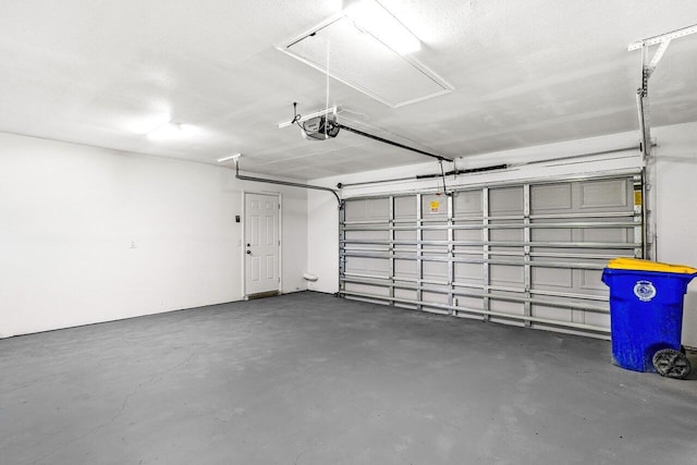 garage featuring a garage door opener