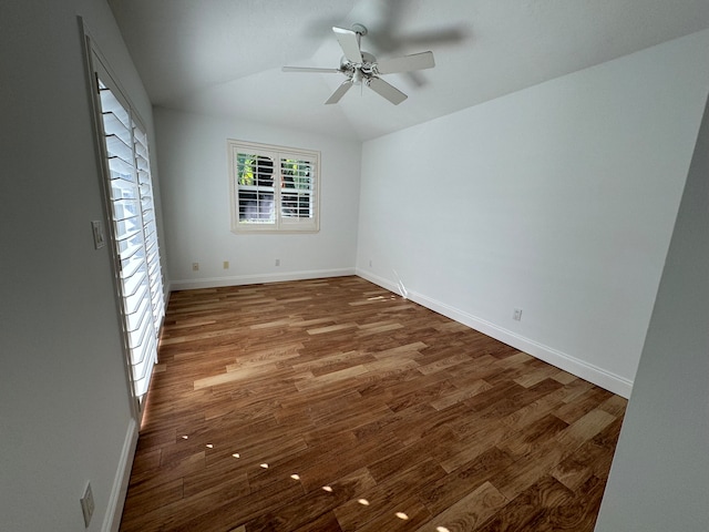 empty room with ceiling fan and wood-type flooring