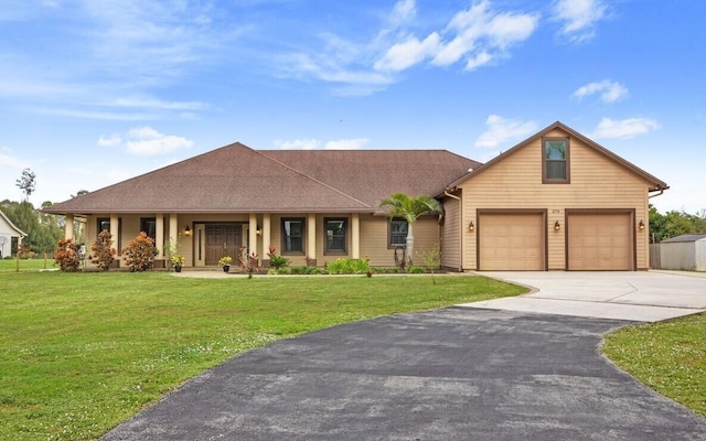 view of front facade featuring a front yard and covered porch