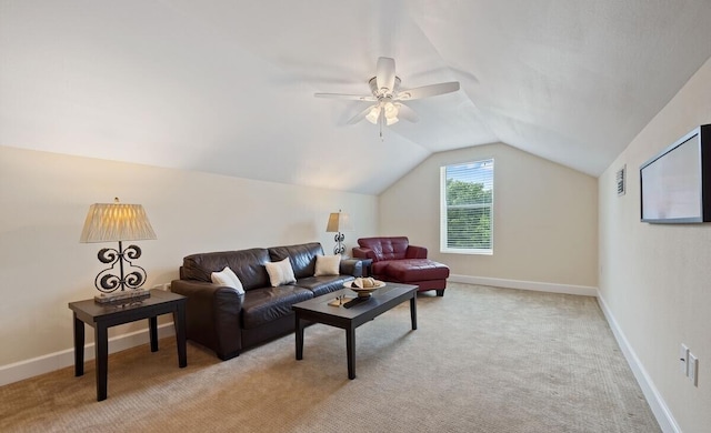 carpeted living room featuring ceiling fan and lofted ceiling