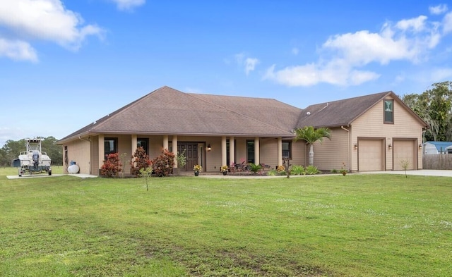 ranch-style home with a front yard, a garage, and covered porch