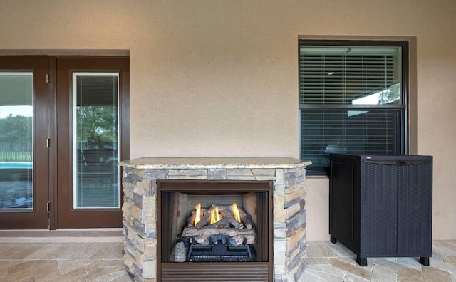 details featuring an outdoor stone fireplace