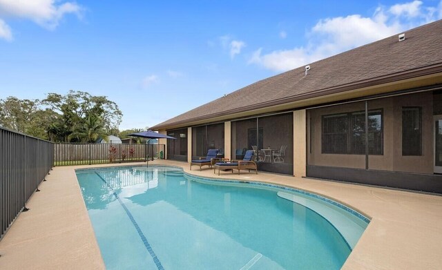 view of swimming pool with a patio