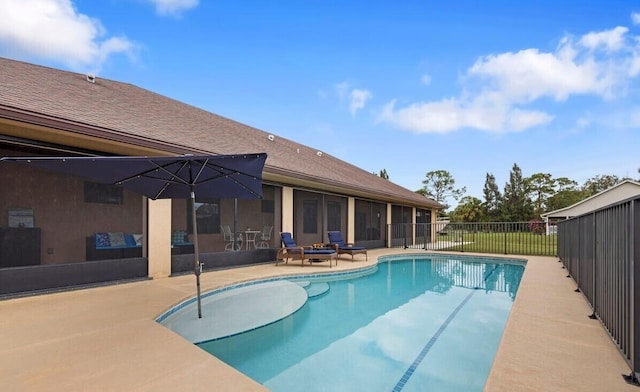 view of swimming pool featuring a patio area