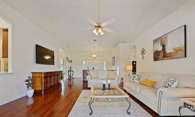 living room with dark hardwood / wood-style floors and ceiling fan