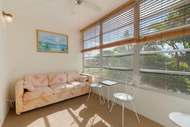 sunroom featuring ceiling fan