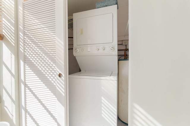 washroom with stacked washer / drying machine